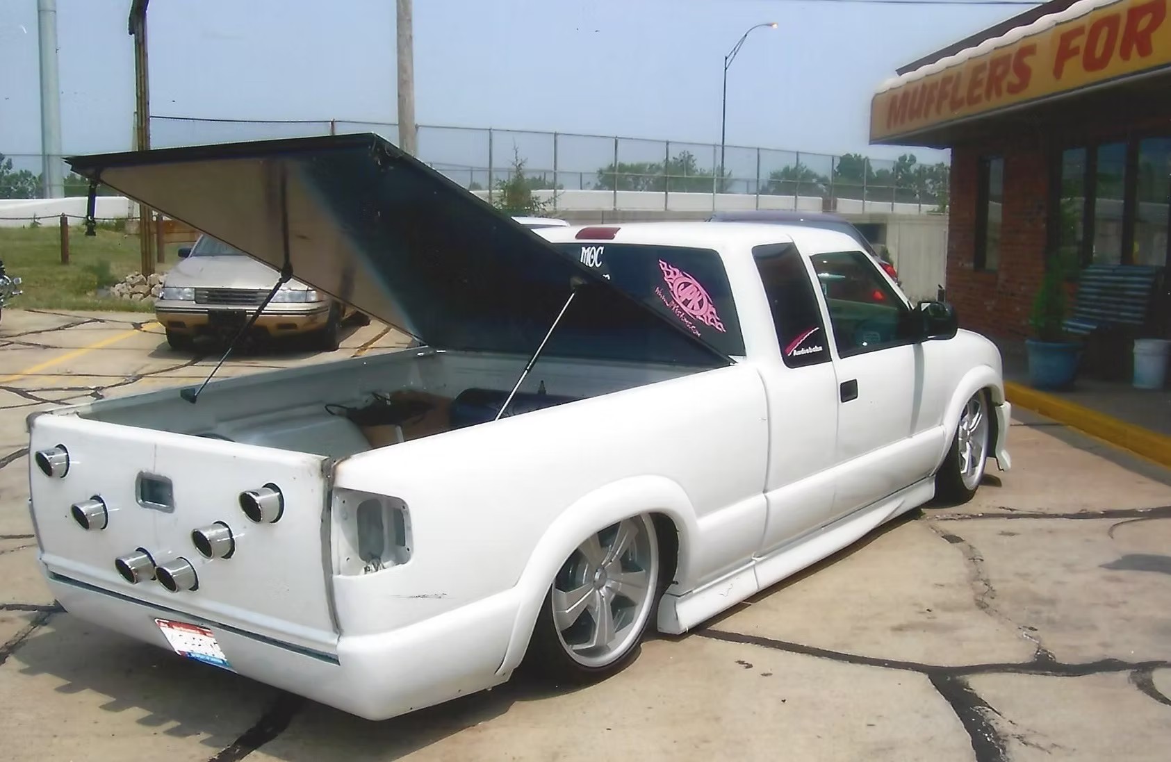 Custom exhaust work on a lowered pickup truck